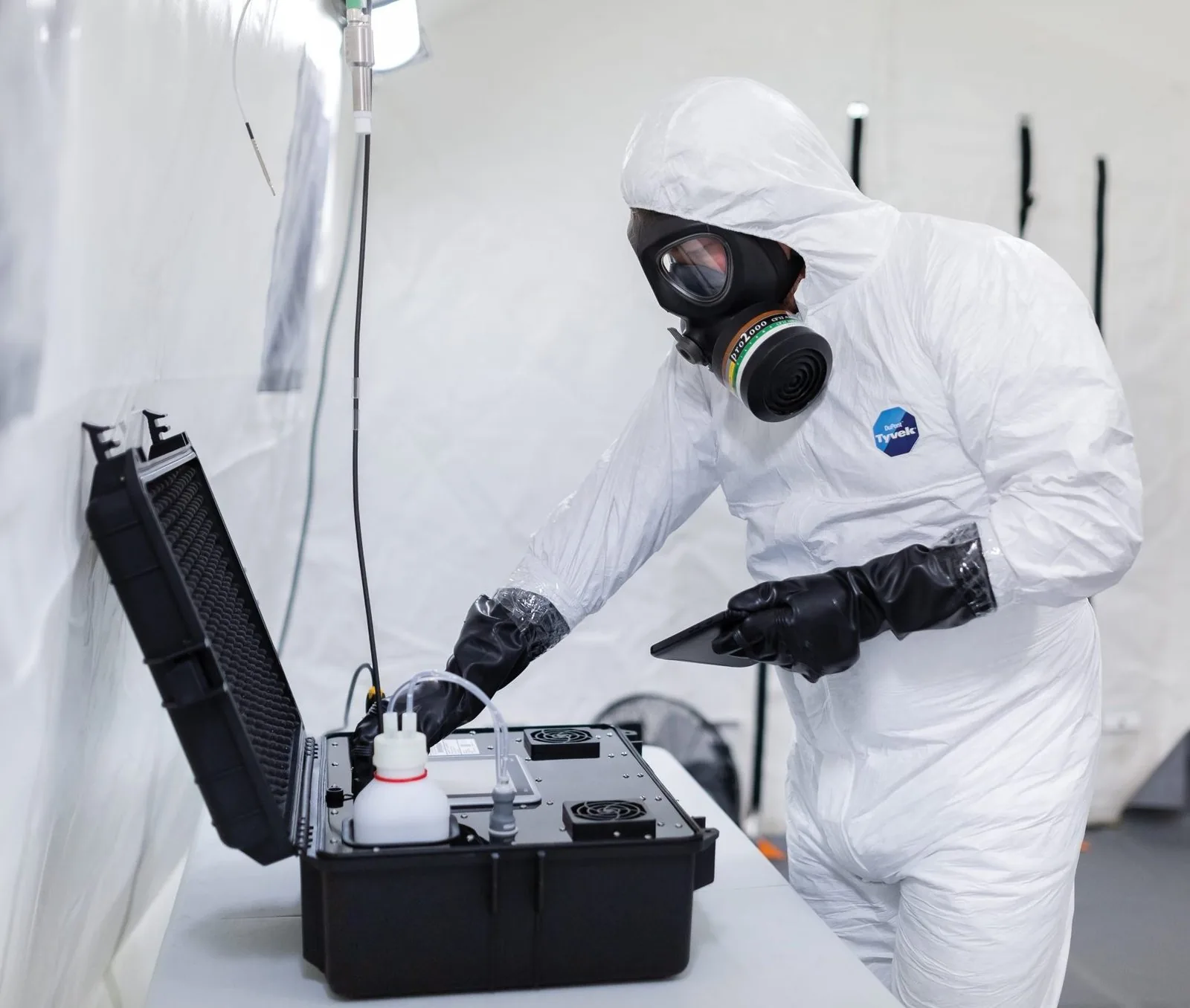 PPE-suited technician deploying VCS in field